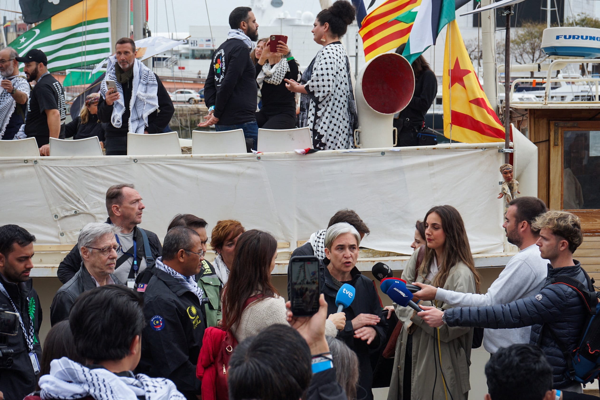 Former Barcelona mayor Ada Colau, who participated in the 2025 Global Sumud Flotilla, speaks to the press as a flotilla prepares to depart for Gaza from Barcelona, Spain, April 12, 2026. (photo credit: REUTERS/Richard Matousek)