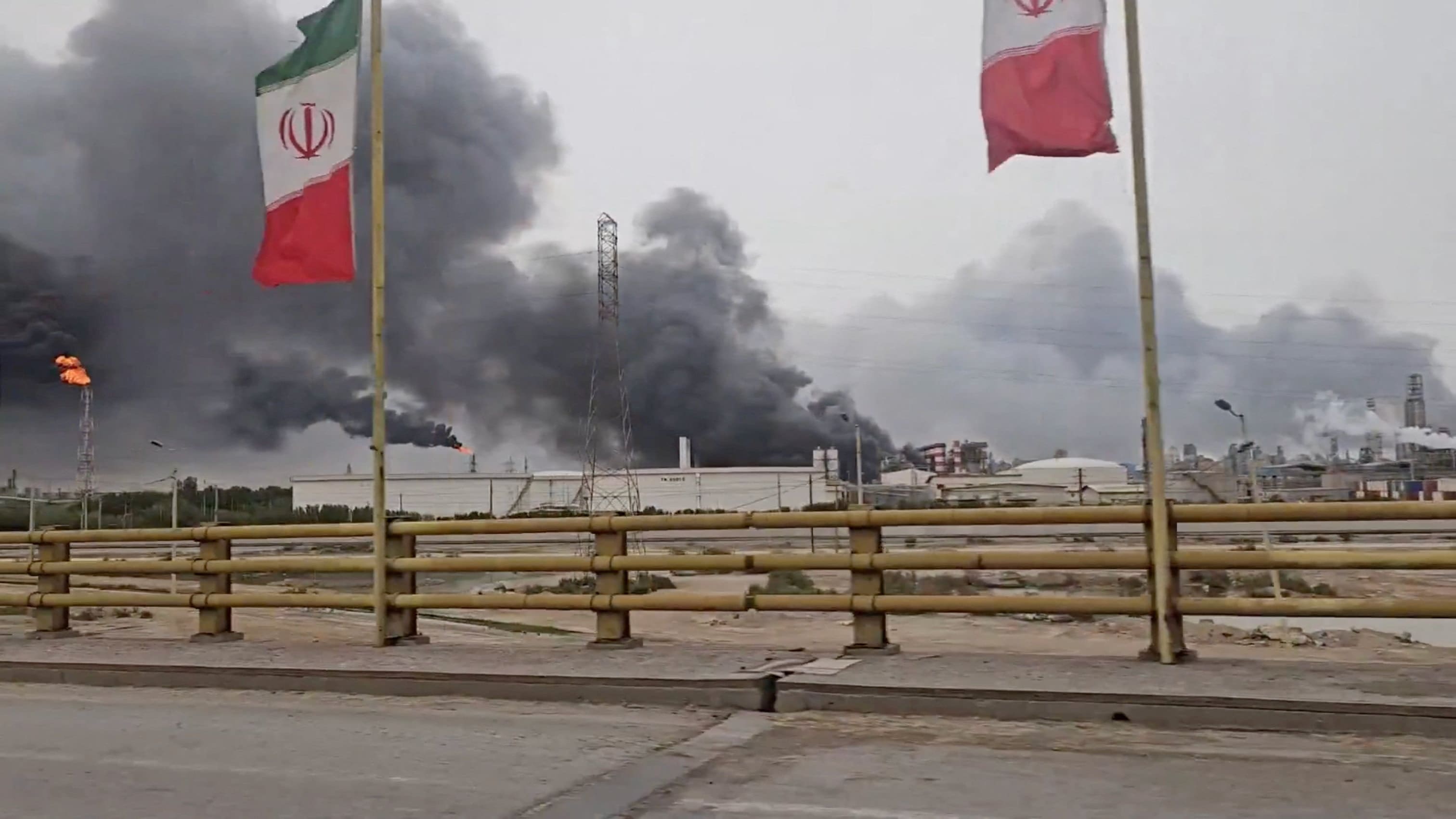 Smoke rises after strikes on the Mahshahr Petrochemical Zone in Bandar Mahshahr County, Khuzestan Province, Iran, in this handout picture released April 4, 2026, and obtained from a social media video. (photo credit: Social Media/via REUTERS)