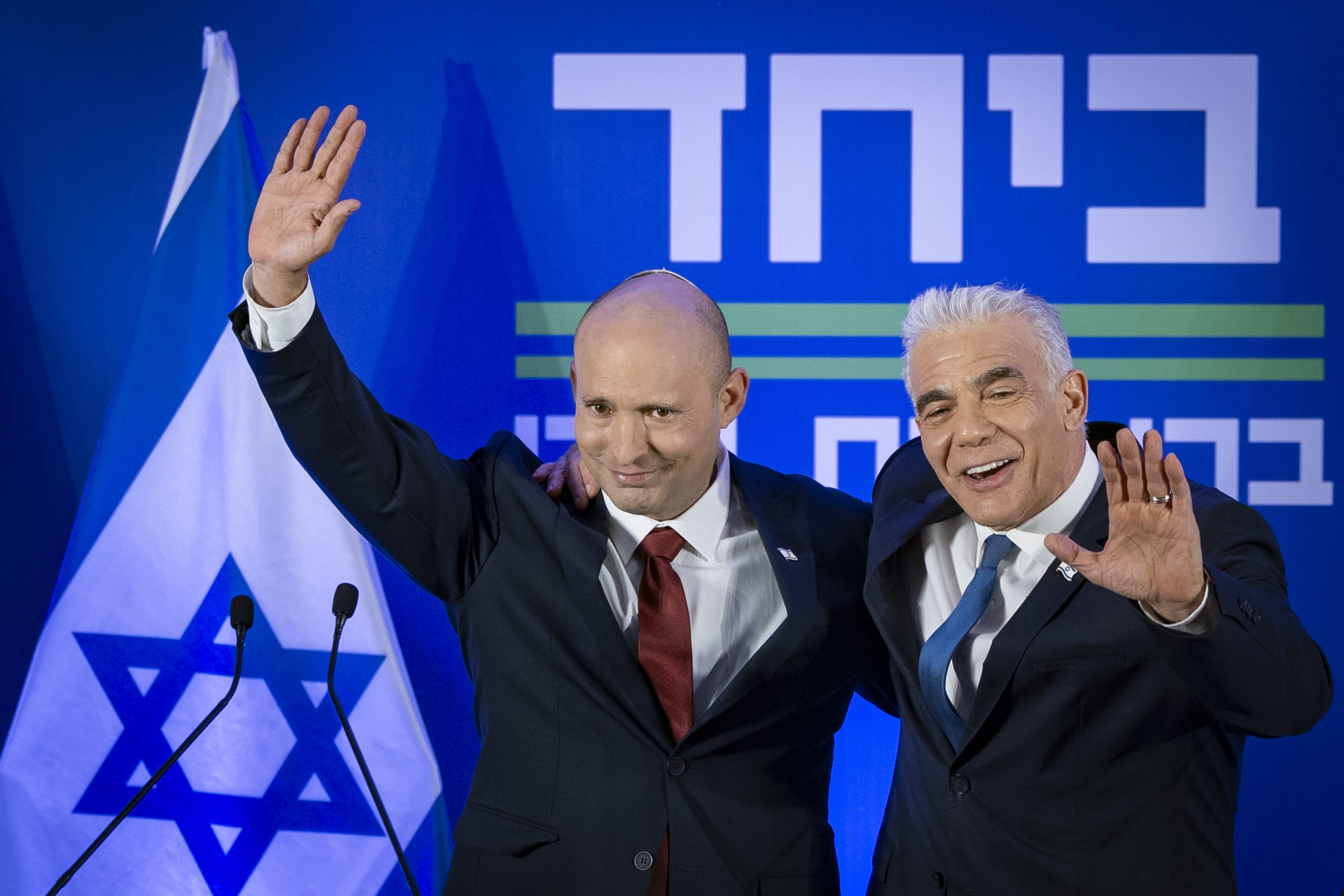 Opposition Leader and Head of the Yesh Atid party Yair Lapid and former Prime Minister Naftali Bennett speak during a press conference announcing a joint list named “Together” ahead of upcoming elections, to be led by Bennett, in Herzliya, central Israel, April 26, 2026.  (photo credit: CHAIM GOLDBERG/FLASH90)