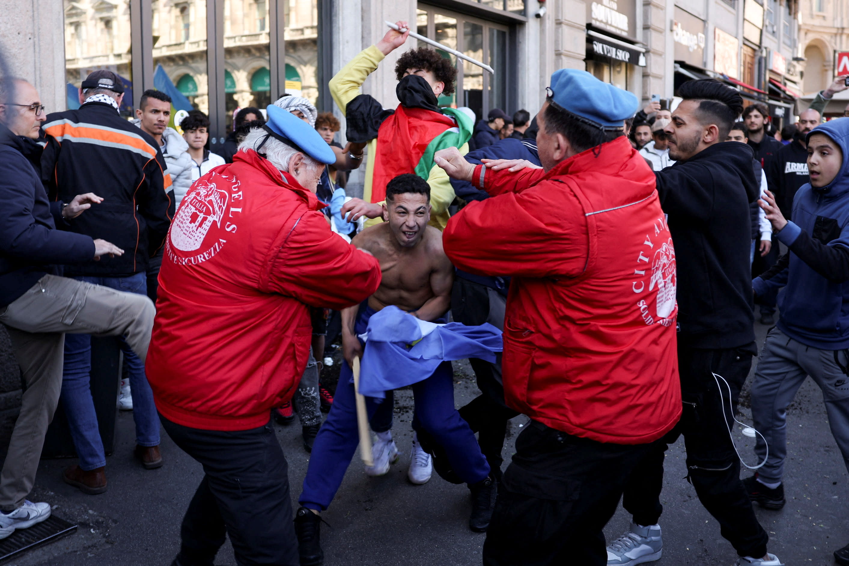 Participants clash during the 79th anniversary of the Liberation Day that commemorates the victory of the Italian resistance movement against Nazi Germany and the Italian Social Republic, in Milan, Italy, April 25, 2024. (photo credit: REUTERS/CLAUDIA GRECO)