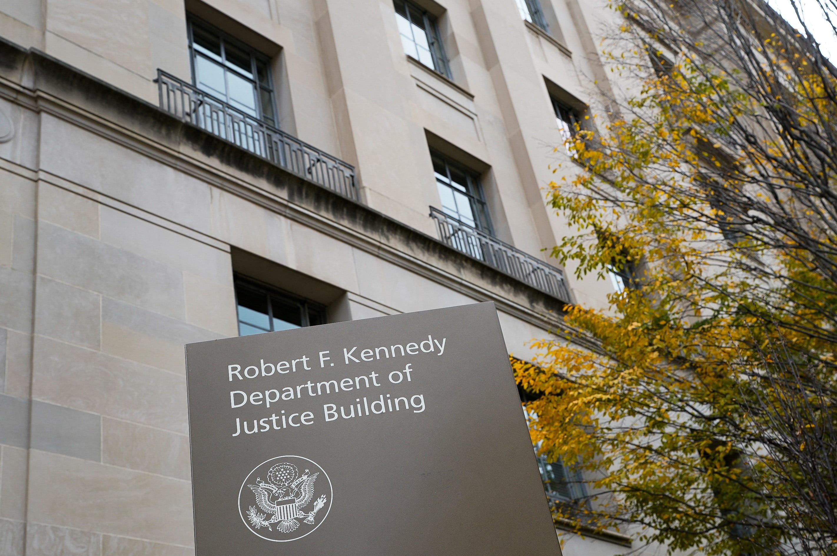 A sign stands at the US Department of Justice building in Washington, D.C., U.S., November 14, 2025.  (photo credit: REUTERS/ELIZABETH FRANTZ)