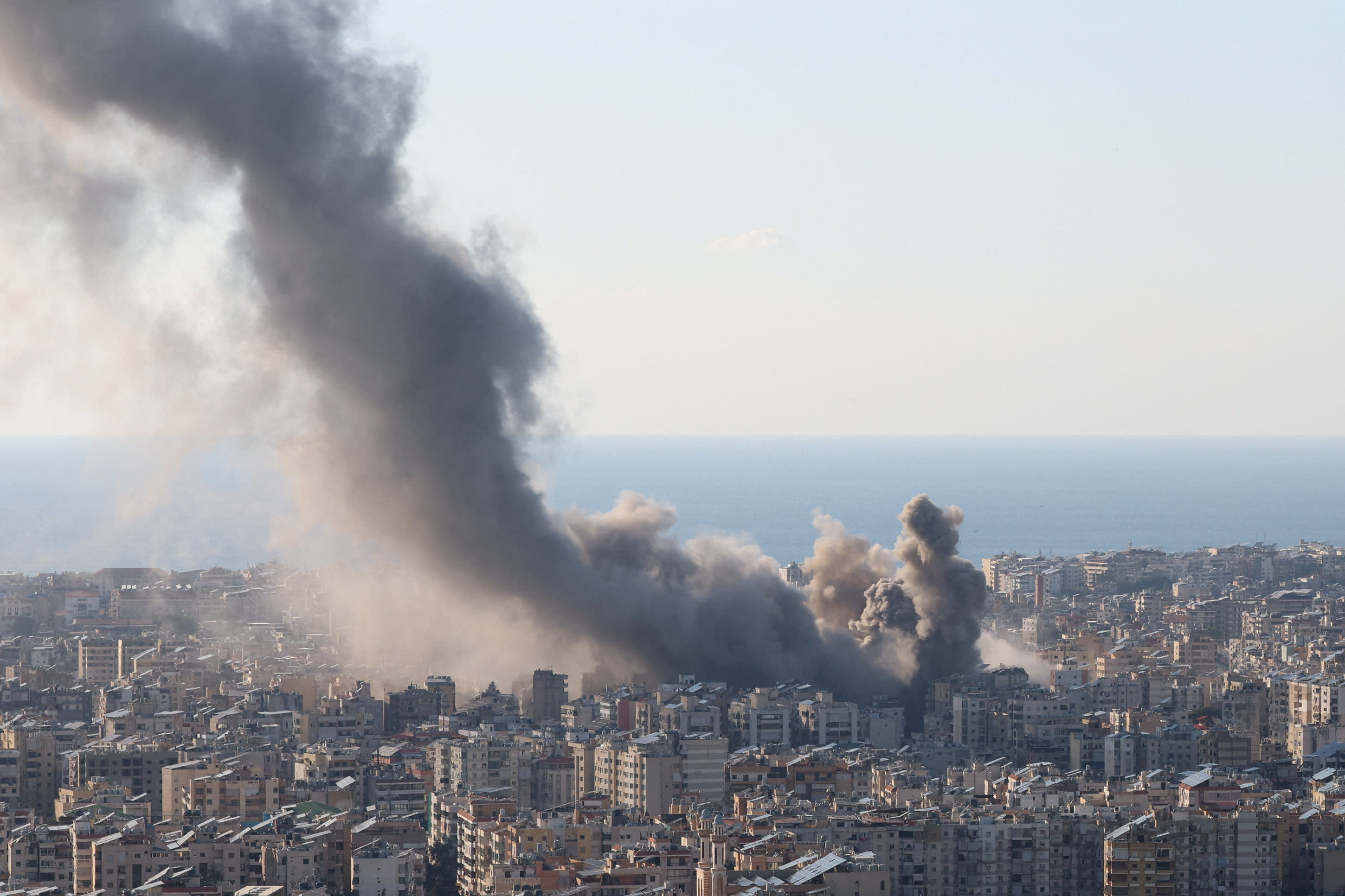 Smoke and dust rise after an Israeli strike on Beirut