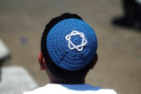 A boy wears a yarmulke