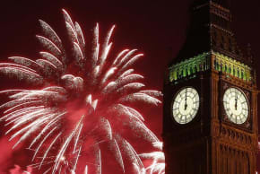 Fireworks explode behind the Houses of Parliament and Big Ben on the River Thames during New Year's celebrations in London