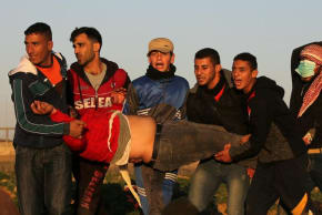 Palestinians evacuate a demonstrator during a protest at the Israel-Gaza border fence, in the southern Gaza Strip January 11, 2019