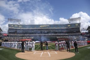 Mar 28, 2019; Oakland, CA, USA; Oakland Athletics and Los Angeles Angels players line up before the game at Oakland Coliseum