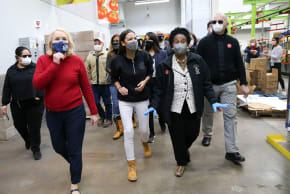 U.S. Rep. Sylvia Garcia (D-TX), Rep. Alexandria Ocasio-Cortez (D-NY) and Rep. Sheila Jackson Lee (D-TX) wave to volunteers as they make their way to their work station at the Houston Food Bank in Houston, Texas, U.S. Febraury 20, 2021