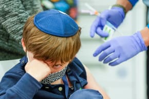  Eli Stern prepares to get his shot at a Humber River Hospital vaccination clinic after Canada approved Pfizer's coronavirus disease (COVID-19) vaccine for children aged 5 to 11, in Toronto, Ontario, Canada November 25, 2021. 