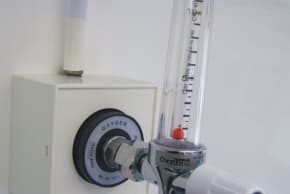  Oxygen piping and regulator on the wall of an ambulance.