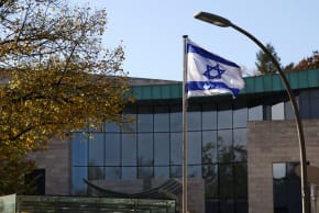 An Israeli flag flutters as police secure the area of the embassy of Israel in Berlin, Germany, October 20, 2024. 