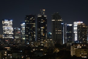 Night view of skyscrapers in the skyline of Tel Aviv, on July 6, 2025