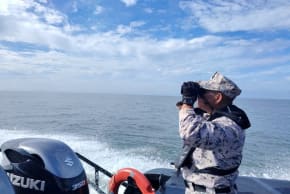 A staff member of the Malaysian Maritime Enforcement Agency searches for victims of a boat from Buthidaung, Myanmar, that sank near the Malaysia–Thailand border, during a search and rescue operation close to Langkawi, Malaysia November 9, 2025.