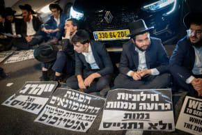 Haredi (ultra-Orthodox) protesters block Highway 4 near Bnei Brak during an anti-draft protest, December 22, 2025.