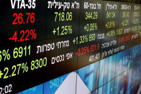 Market data is seen on part of an electronic board displayed at the Tel Aviv Stock Exchange, in Tel Aviv, Israel November 4, 2020.