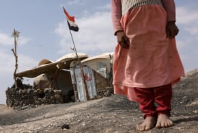 (ILLUSTRATIVE) A displaced Yemeni girl stands outside her shelter inside a displaced persons camp in Marib, Yemen, October 28, 2024.