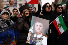 A woman holds an image depicting Iranian opposition figure Reza Pahlavi, during a demonstration in support of the nationwide protests in Iran, in London, Britain, January 25, 2026