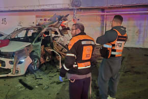 United Hatzalah emergency responders look on in the aftermath of a vehicle explosion in Kiryat Yam, near Haifa, February 4, 2026.