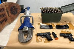 Two handguns, an explosive device, ammunition, and magazines seized from a school compound in Lakiya, Feb 4, 2026.