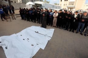 MOURNERS PRAY during the funeral of Palestinians in Gaza, who, according to medics, were killed by an Israeli strike, on Wednesday. While Hamas was flooding the world with unverified figures, Israel made no systematic effort to challenge them, the writers say. 