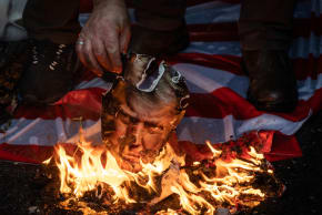 IRANIAN PRO-GOVERNMENT supporters burn pictures of US President Donald Trump, last month. If Trump’s bluster against Iran just leads to another soft deal that kicks the Iranian nuclear can down the road, then Trump’s presidency is finished, the writer says. 