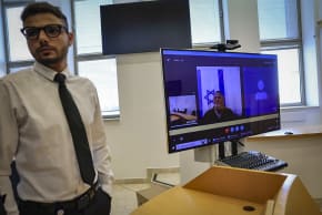 Bezalel Zini, accused of smuggling cigarettes into the Gaza Strip, is seen on a screen at the Beersheba District Court, February 5, 2026
