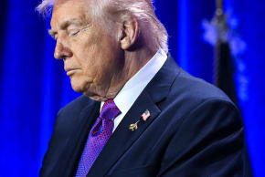 US President Donald Trump bows his head in prayer during the National Prayer Breakfast at the Washington Hilton in Washington, DC on February 5, 2026.