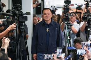 Thailand's caretaker Prime Minister Anutin Charnvirakul, Bhumjaithai Party leader and prime ministerial candidate, arrives for a press conference at the party headquarters on the day of the general election, in Bangkok, Thailand, February 8, 2026. 