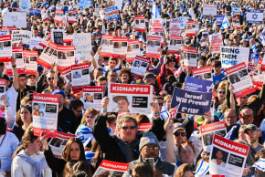 Participants hold up posters of hostages as thousands of people attend the March for Israel on the National Mall in November 2023 in Washington, DC. Following October 7, American Jews mobilized more than $1 billion for Israel’s relief and recovery.