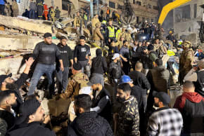 Rescue teams search for survivors after a building collapsed in Tripoli, Lebanon, February 8, 2026. 