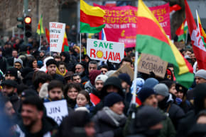 Members of the Kurdish community and other protesters attend a demonstration against recent military clashes between the Syrian army and Kurdish forces, in Berlin, Germany, January 24, 2026.