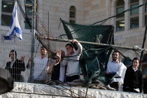 Israeli settlers gesture during a weekly settlers' tour in Hebron, in the West Bank, February 7, 2026. 