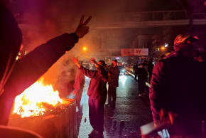 Fires are lit as protesters rally on January 8, 2026 in Tehran, Iran.