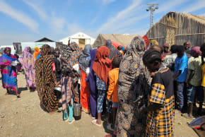Displaced Sudanese wait to receive humanitarian aid at the Abu al-Naga displacement camp in the Gedaref State, some 420km east of the capital Khartoum on February 6, 2026.