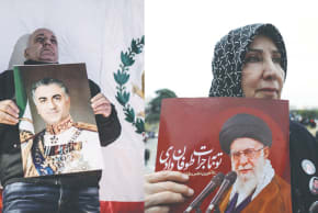 DEMONSTRATORS HOLD posters with pictures of Iran’s Crown Prince Reza Pahlavi and Supreme Leader Ayatollah Ali Khamenei, representing anti- and pro-regime viewpoints. 