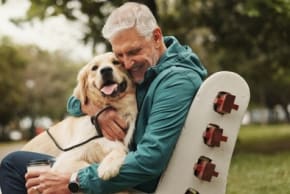A man hugging his dog