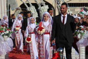 Palestinian couples attend a mass wedding in Khan Younis, in the southern Gaza Strip December 2, 2025. 