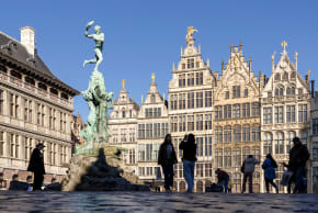 People stroll through the Grand Place (Grote Markt) near the Brabo Fountain in Antwerp, Belgium November 7, 2025.