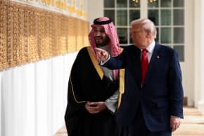 US President Donald Trump and Saudi Crown Prince and Prime Minister Mohammed bin Salman look at portraits at the "Presidential Walk of Fame" in the Colonnade at the White House in Washington, DC, November 18, 2025.
