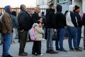 PALESTINIANS QUEUE at an Israeli checkpoint, as they make their way to the Temple Mount, in Jerusalem's Old City, to attend the first Friday prayers during the Muslim holy fasting month of Ramadan, in Bethlehem in the West Bank, February 20, 2026.