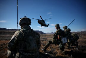 A DANISH helicopter flies near soldiers as Danish, Swedish and Norwegian home guard units together with Danish, German and French troops take part in joint military drills in Kangerlussuaq, Greenland, September 17, 2025.