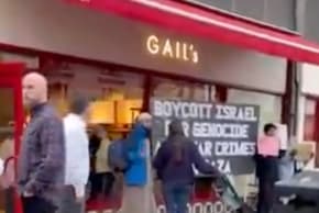 Pro-Palestinian protesters outside of Gail's Bakery in north London.