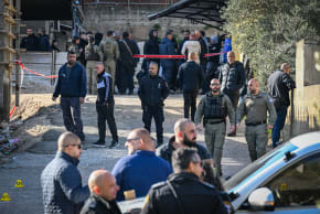 Israeli security forces are seen at the scene where three men were shot dead by assassins in the city of Shfaram, northern Israel, January 7, 2026
