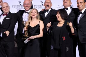 Creator and Executive Producer Dana Eden and Executive Producer Shula Spiegel pose backstage with cast and crew members after winning an Emmy for "Tehran" in the category Drama at the 49th International Emmy Awards in New York City, New York, U.S., November 22, 2021.