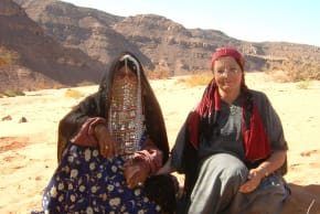 Margaret Malka Rawicz sits with a Bedouin lady who took her to tend sheep in Sinai Desert. 