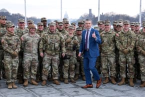 US Defense Secretary Pete Hegseth poses with US Army National Guard soldiers at a swearing-in ceremony at the Washington Monument, Washington, February 6, 2026; illustrative.