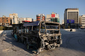 A bus burned during protests, on a street in Tehran, Iran, January 16, 2026