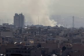 A plume of smoke rises following a reported explosion in Tehran on February 28, 2026.