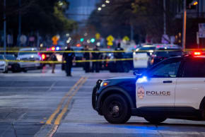 Law enforcement patrol an intersection near Buford's bar in downtown on March 01, 2026 in Austin, Texas.