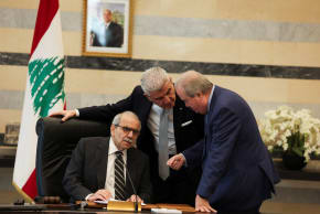 Lebanese Prime Minister Nawaf Salam speaks with Finance Minister Yassine Jaber and Lebanese Industry Minister Joe Issa el-Khoury during a cabinet meeting in Beirut, Lebanon, December 23, 2025.