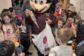 A person in a Minnie Mouse costume entertains guests at a Purim party in a bomb shelter in Israel, March 2, 2026.
